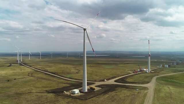 Flying along the wind farm on a cloudy day