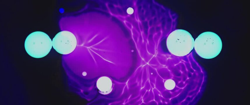 Macro Textures with Vibrant Neon Color Palette. Abstract Background Made with Oil Mixed with Teal and Purple Dye, Ink, and Paint.
