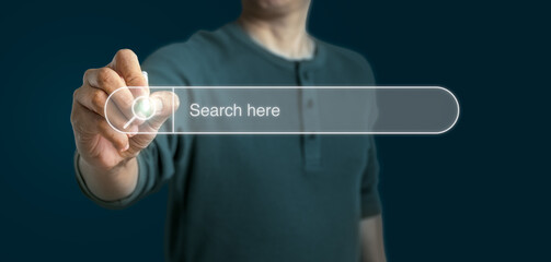 Man touching on search icon on virtual screen. Panoramic of Searching internet data Information Concept with copy space