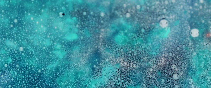 Macro Textures with Vibrant Neon Color Palette. Abstract Background Made with Oil Mixed with Teal Dye, Ink, and Paint.