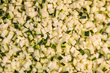 Chopped raw zucchini, close-up, diced zucchini macedonia. High quality photo