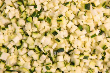Chopped raw zucchini, close-up, diced zucchini macedonia. High quality photo