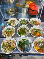 Assortment of Vietnamese noodle soup in food court