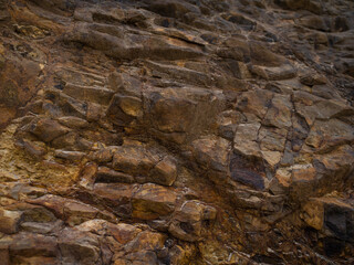 Orange stone rock, stone, textured. Background for design. Soft light.