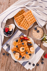 Waffles with blueberries, bananas and honey.