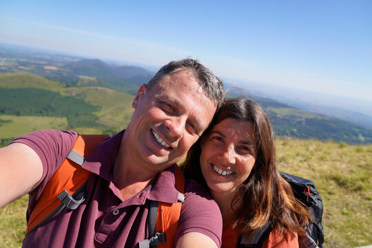 Middle Age Beautiful Couple Taking A Selfie Phone On The Mountain Background