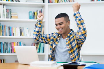 Hispanic young adult man playing computer games