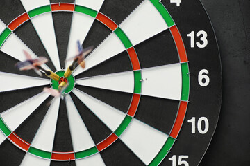 Darts. The dart for playing in the game board is stuck. Hit the sector in darts. The concept of a successful strategy.