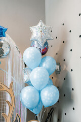 Festive balloons in blue and silver colors for your birthday. Photo zone decor