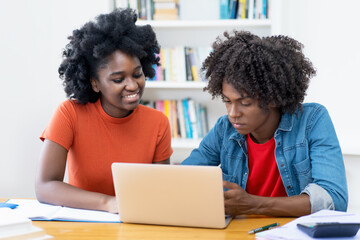Two african american learning computer science students