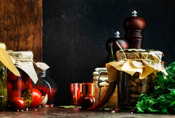 Fermented, pickled, marinated preserved vegan food. Organic vegetables and fruits in jars with...