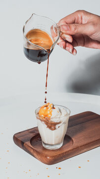 Hand woman make a coffee affogato in coffee shop,Affogato coffee with ice cream