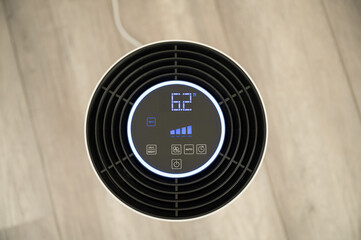 White UV-C air purifier filters viruses and pollutants from indoor air