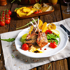 Lamb chops marinated in herbs with green asparagus and lime