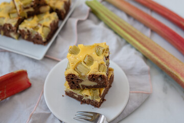 Home made rhubarb cheesecake chocolate brownie on a table