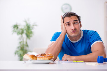 Young hungry man in dieting concept