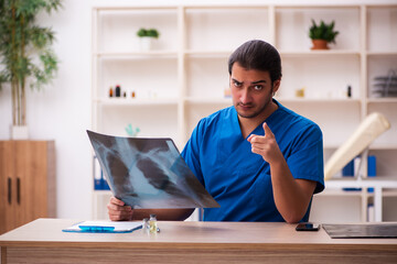 Young male doctor radiologist working in the clinic