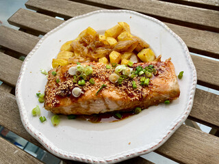 Homemade Salmon with Chives, Honey, Vinegar and Served with Caramelized Onion Potatoes.