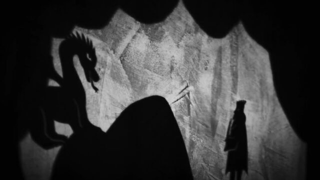 Vintage animation, shadow theatre on a wall. Pantomime, fantasy story. Halloween scene, black and white storytelling. Classic fable for children, creepy puppets.