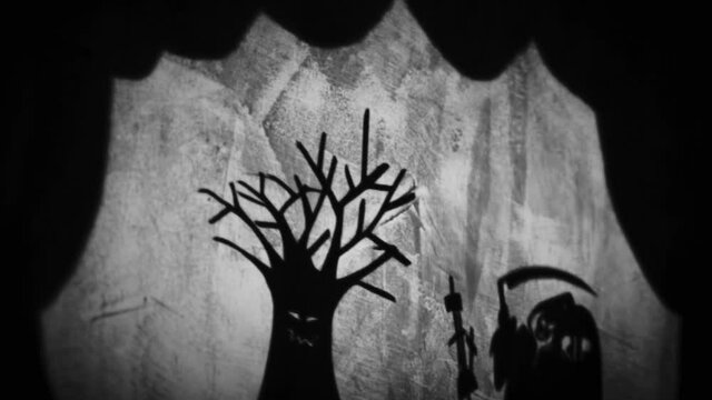 Vintage animation, shadow theatre on a wall. Pantomime, fantasy story. Halloween scene, black and white storytelling. Classic fable for children, creepy puppets.