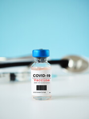 Close-up of a simulated Covid-19 vaccine in a vial for protective coronavirus on white background...