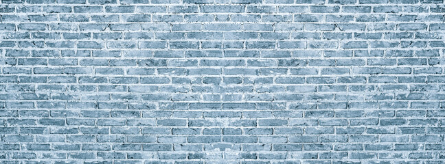 Old vintage retro style blue color bricks wall for panorama brick background and texture.