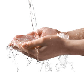 Pouring water into woman's hands on grey background, closeup