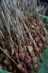 Close-up of delicious chicken satay arranged on tray