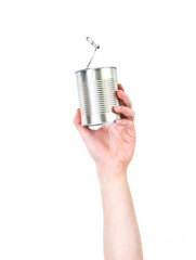 Man's arm raised holding a canned food. Recycling concept. Isolate on white background.