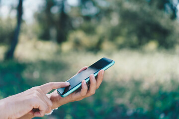 Woman hand using smartphone to do work business, social network, communication.