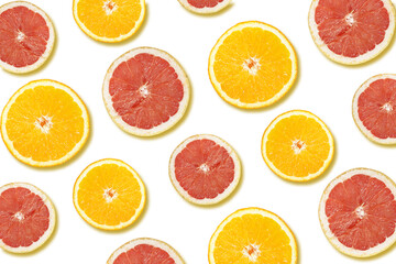 A pattern of an orange and a grapefruit halves on a white surface