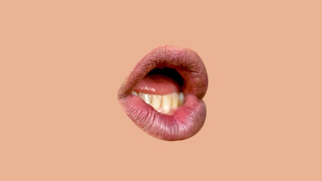 Male lips moving agaisnt pale peach background