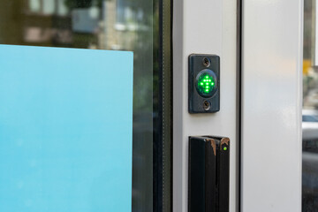 Magnetic Card Access Control System with green arrow indicator on the door. Magnetic Cards and Reader. Smart card door key lock system in bank, card key concept.