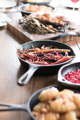 Roast meal on rustic country timber dinner table