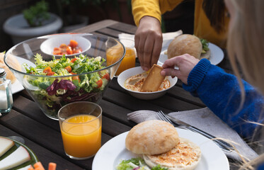 A group of woman eating hummus