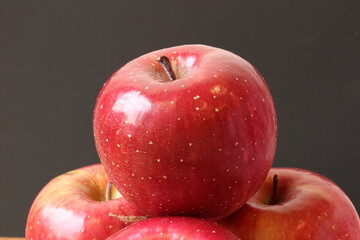 Fuji apples isolated on black background