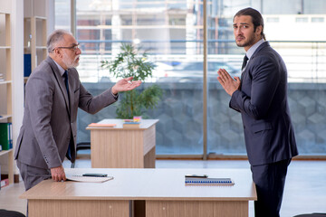 Two businessmen discussing business project