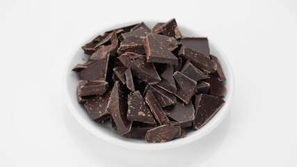 crushed dark chocolate isolated on white background
