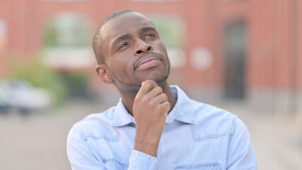 Portrait of Thoughtful Young African Man Thinking