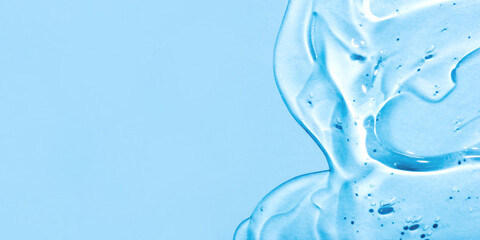 Transparent hyaluronic acid gel on a blue background.