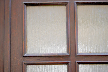 Old massive door with decorative door handle and lock, all still functional