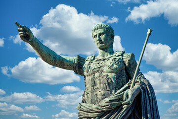 The roman emperor Gaius Julius Caesar statue in Rome, Italy. Concept for authority, domination, leadership and guidance. - obrazy, fototapety, plakaty