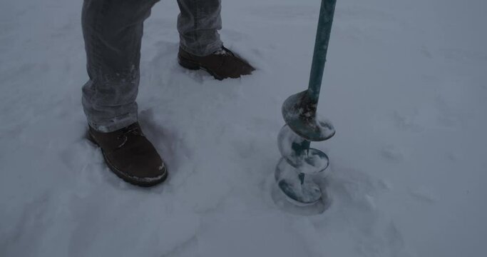 drilling holes in ice close-up