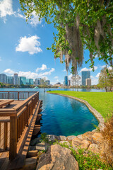 Lake Eola park in Orlando on a sunny day - obrazy, fototapety, plakaty