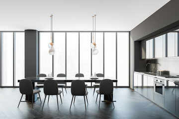 Interior of modern kitchen with wooden floor, furniture, table and chairs, panoramic window. Dining room. Oak parquet. Home architecture concept.