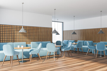 Modern cafe interior with wooden table and blue chairs, panoramic windows