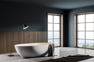 Fototapeta na wymiar Bathroom interior with bathtub and foot towel with lamp on grey floor
