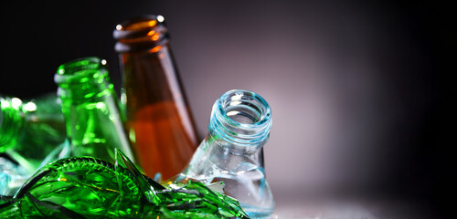 Broken glass bottles and pieces of glass. Recycling.