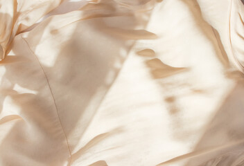 Abstract beige background flat layout. Modern minimalistic background with crumpled fabric texture...