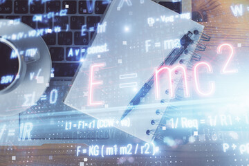 Double exposure of tech formula drawing and work table top veiw. concept of education.